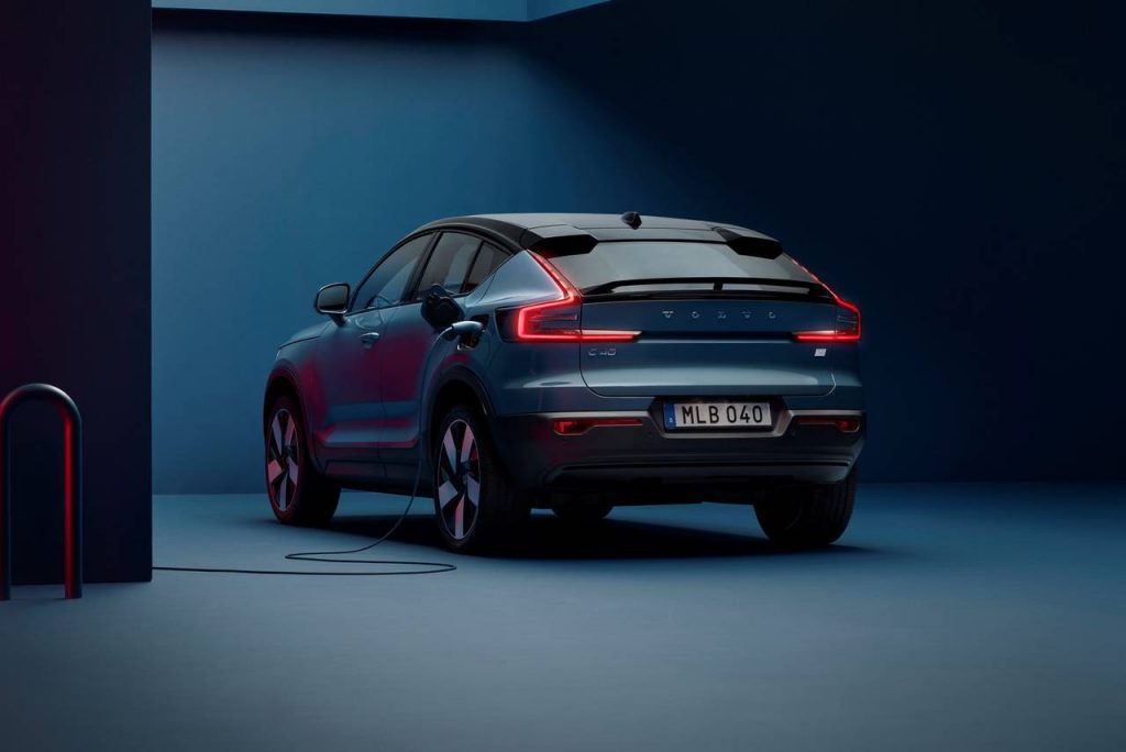 2022 Volvo C40 Recharge EC SUV  rear view with charging station