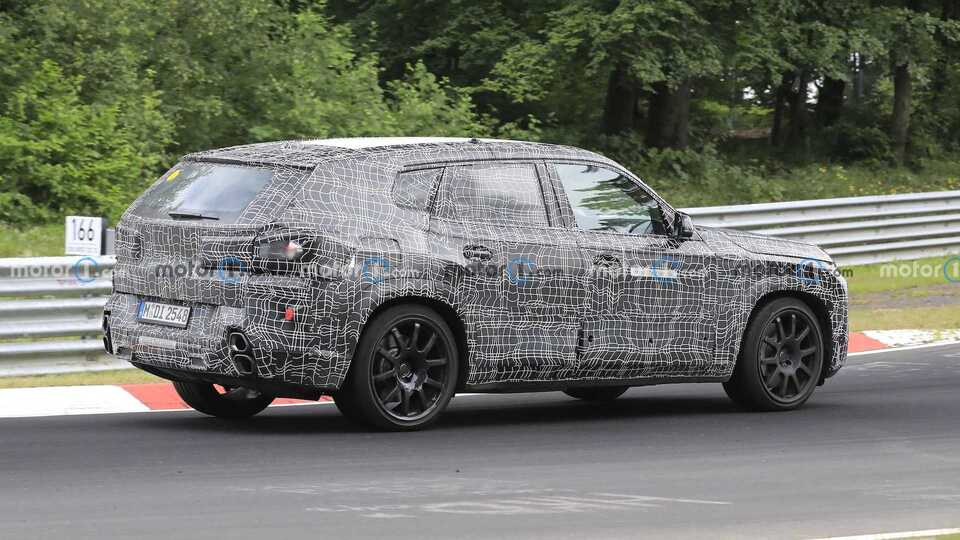 2023 BMW XM Luxury Plug-in Hybrid SUV rear side view